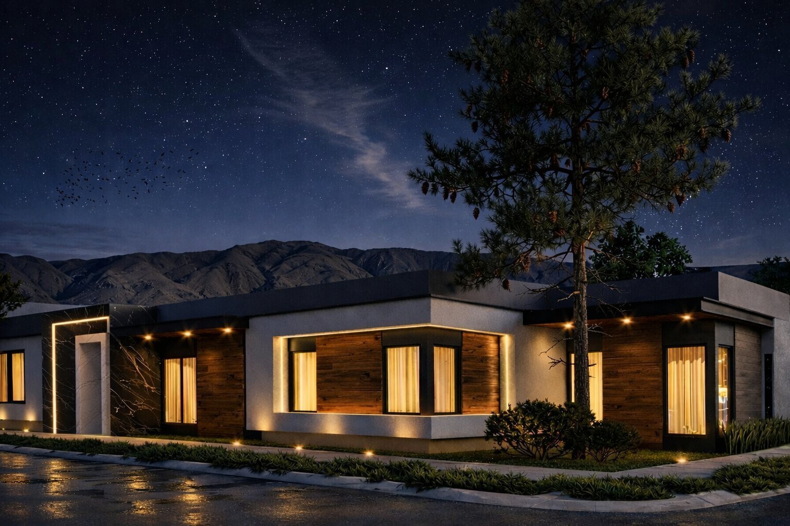 Casa José Matías de noche con fachada moderna iluminada y cielo estrellado con montañas al fondo