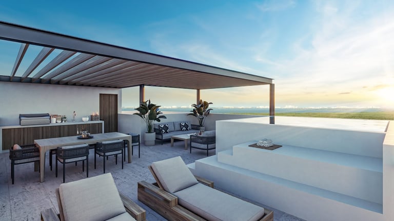 Modern rooftop terrace with lounge chairs and ocean view at sunset