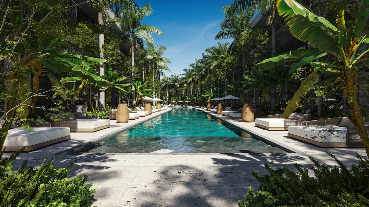 Luxury tropical resort swimming pool with palm trees and turquoise water