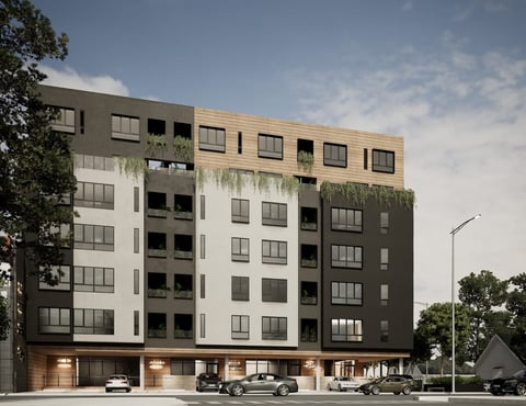 Modern mixed-use building with residential apartments above ground-floor retail and parking, featuring wood and metal facade panels