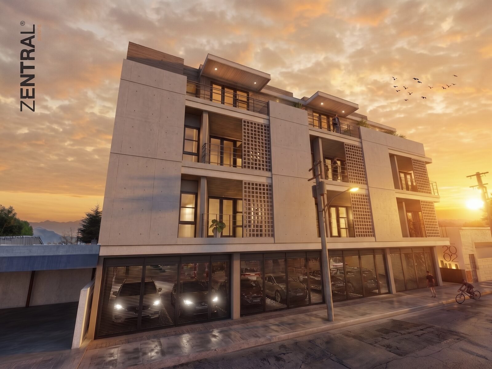 Modern residential building at sunset with illuminated windows and ground-level parking garage