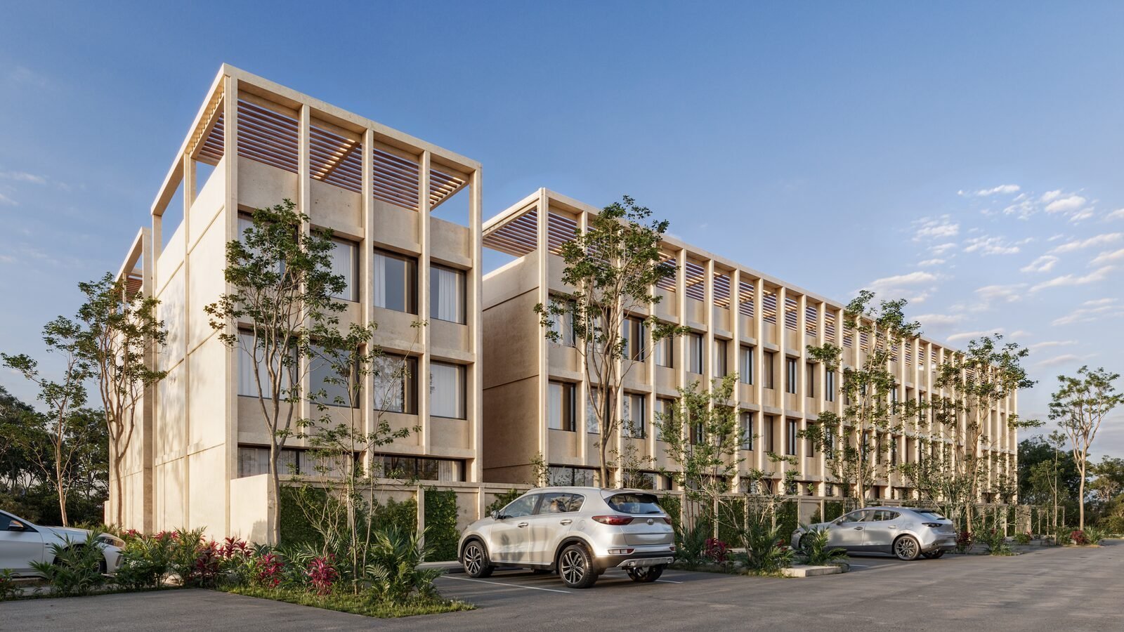 Modern residential building with wooden lattice facade, parked cars, and landscaping trees against blue sky