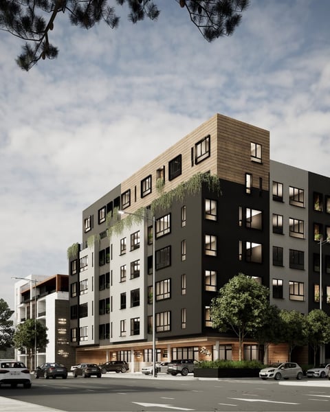 Modern mixed-use residential building with mixed light and dark facade panels, retail storefronts at street level, and parked cars