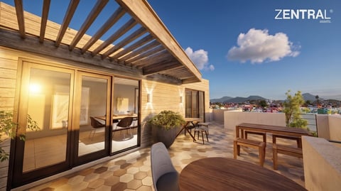 Modern rooftop terrace with wooden pergola, glass doors, furniture, and city view at sunset
