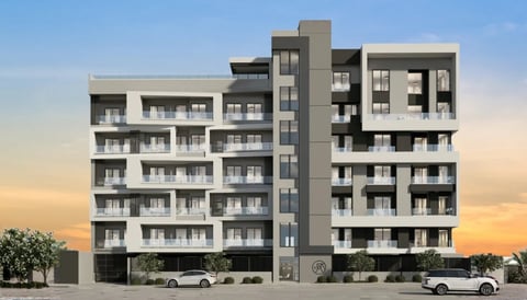 Fachada del edificio residencial Arïe Urban Living con varios niveles y estacionamiento a nivel de calle
