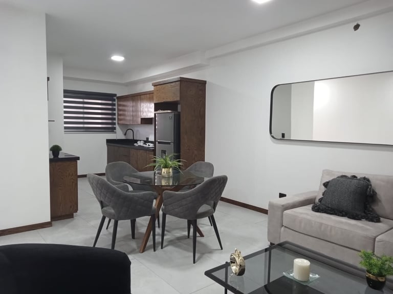 Sala comedor del departamento muestra Urban Loft 511