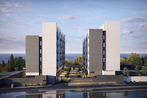 Render arquitectónico de dos torres residenciales modernas con fachadas blancas y grises frente a un espejo de agua