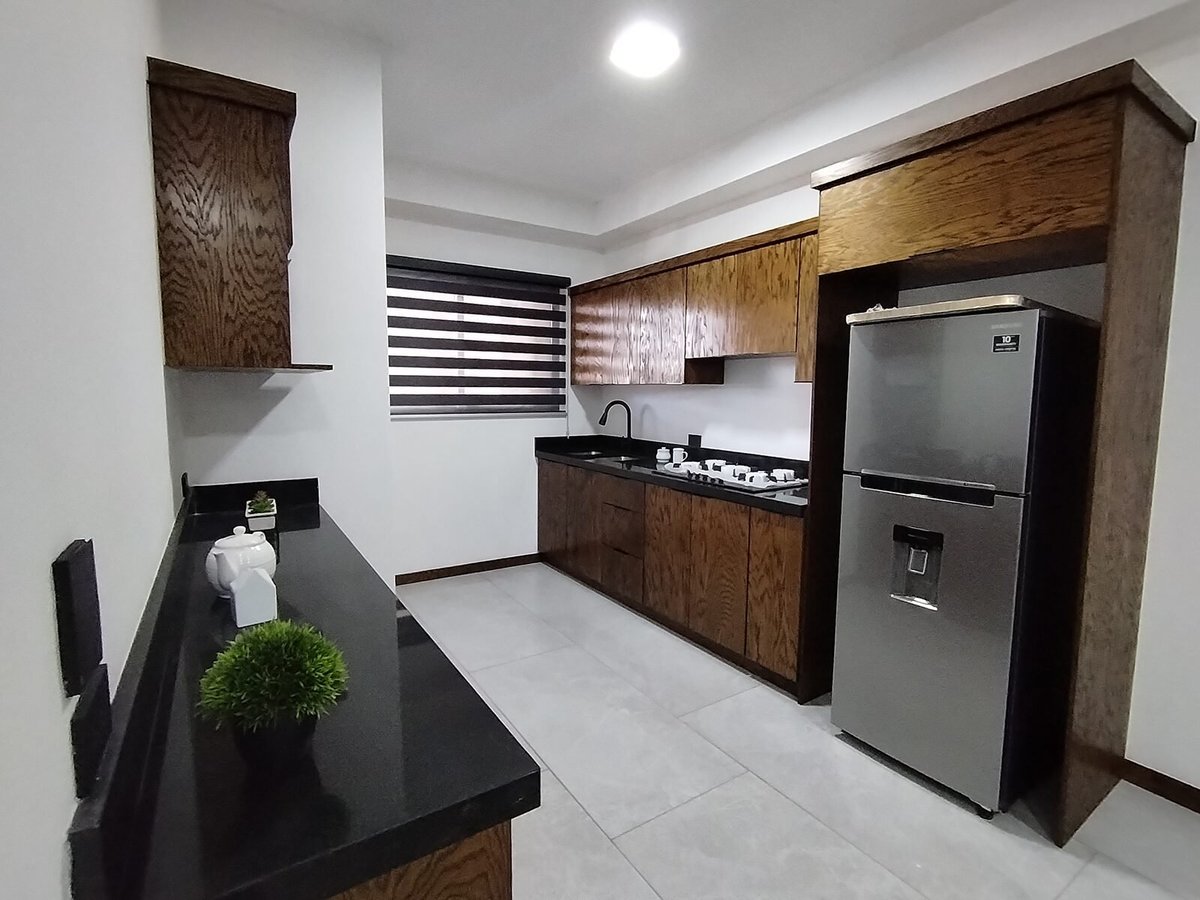 Cocina del departamento muestra Urban Loft 511