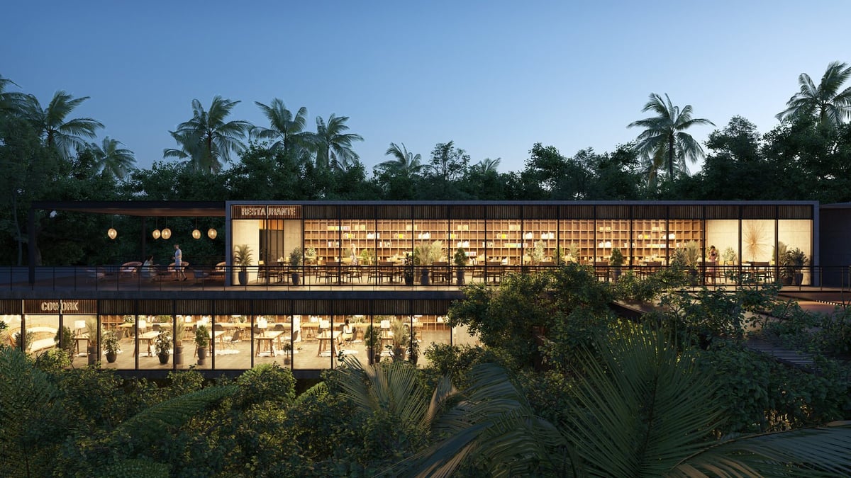 Modern two-story building illuminated at dusk with palm trees