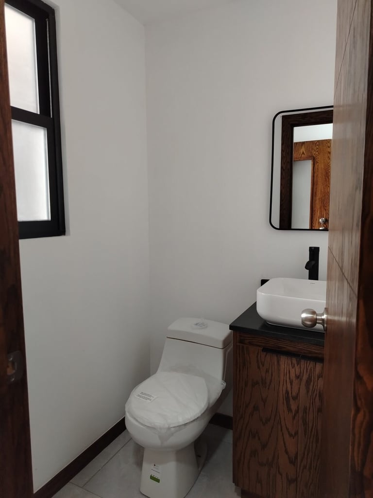 Medio baño del departamento muestra Urban Loft 511