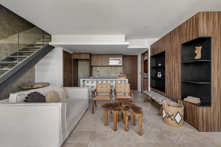 Open-concept loft with white sofa and wood-paneled storage